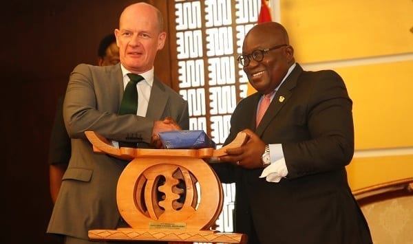 Irish Ambassador to Ghana, Sean Hoy (left) being presented with a traditional stool and other gifts by President Akufo-Addo