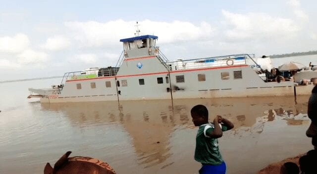 [Video] Dambai: Kia truck loaded with yam falls off ferry into river
